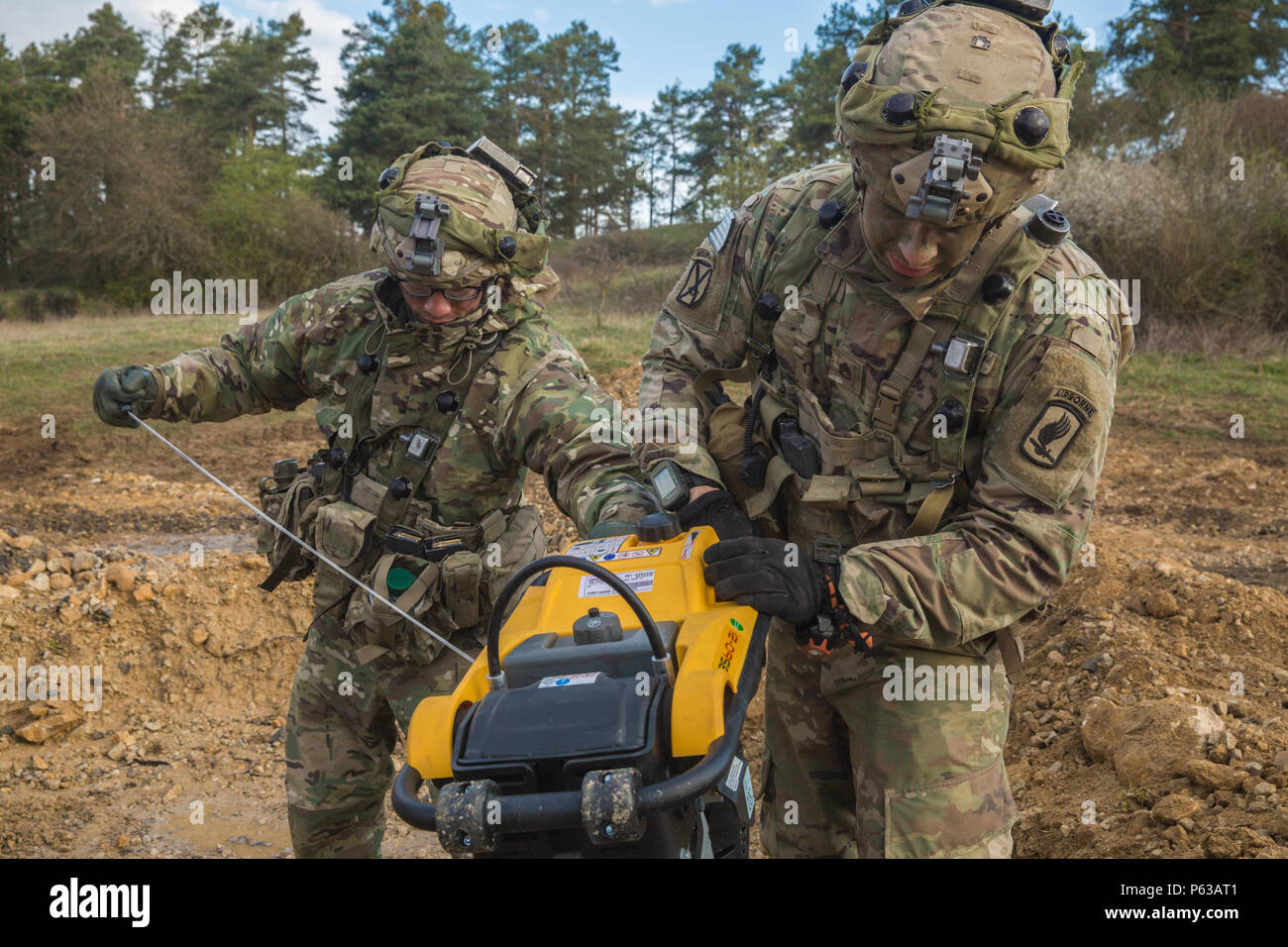 U.S. Soldiers of Bravo Company, 54th Brigade Engineer Battalion, 173rd Airborne Brigade start a compactor while conducting a repair on a simulated airstrip during Saber Junction 16 at the U.S. Army’s Joint Multinational Readiness Center (JMRC) in Hohenfels, Germany, April 13, 2016. Saber Junction 16 is the U.S. Army Europe’s 173rd Airborne Brigade’s combat training center certification exercise, taking place at the JMRC in Hohenfels, Germany, Mar. 31-Apr. 24, 2016.  The exercise is designed to evaluate the readiness of the Army’s Europe-based combat brigades to conduct unified land operations  Stock Photo
