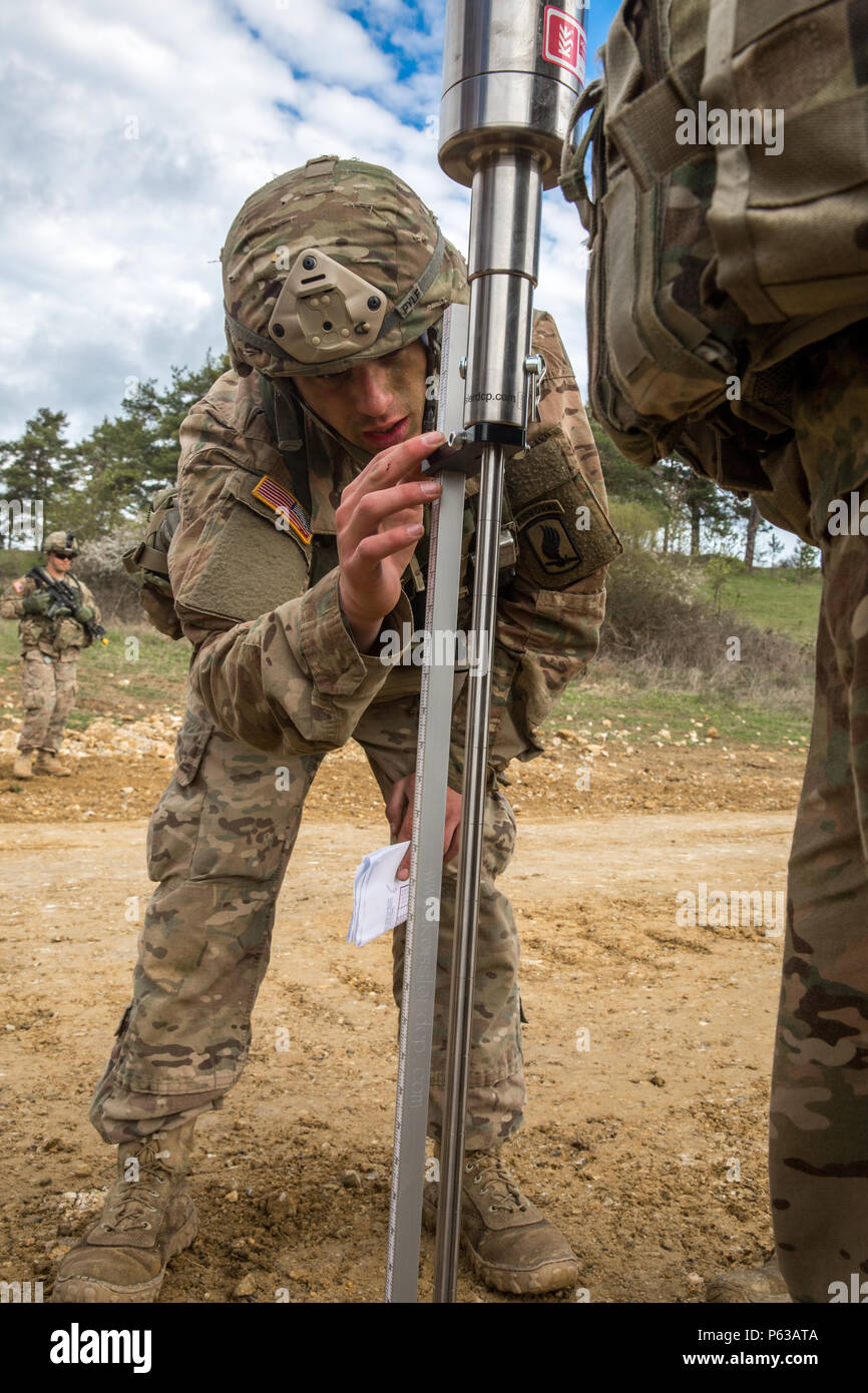 U.S. Soldiers of Bravo Company, 54th Brigade Engineer Battalion, 173rd Airborne Brigade measure the density of the ground after conducting repairs on a simulated airstrip while conducting an airstrip repair during exercise Saber Junction 16 at the U.S. Army’s Joint Multinational Readiness Center (JMRC) in Hohenfels, Germany, April 13, 2016. Saber Junction 16 is the U.S. Army Europe’s 173rd Airborne Brigade’s combat training center certification exercise, taking place at the JMRC in Hohenfels, Germany, Mar. 31-Apr. 24, 2016.  The exercise is designed to evaluate the readiness of the Army’s Euro Stock Photo