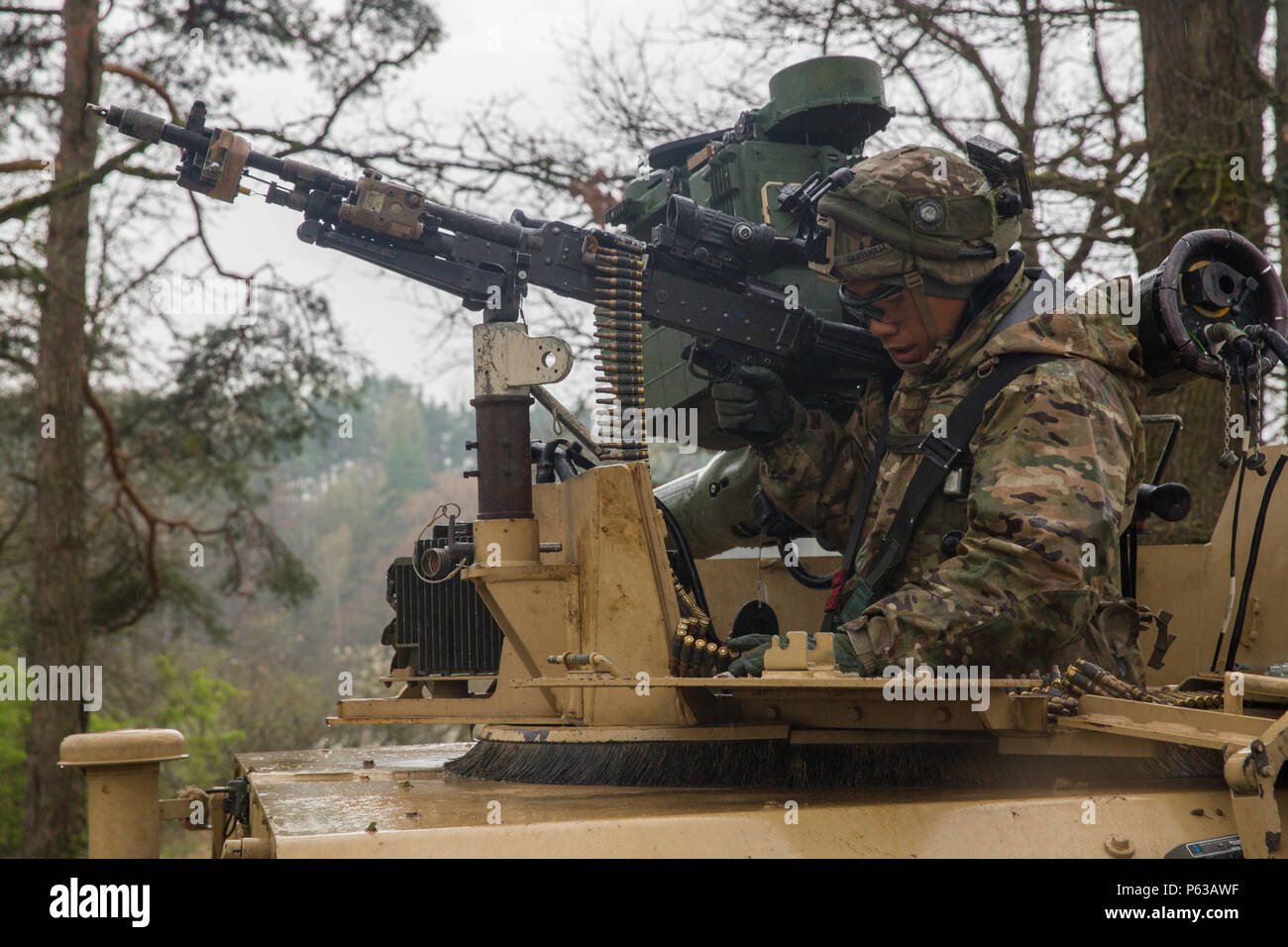 A U.S. Soldier of Delta Company, 2nd Battalion, 503rd Airborne Infantry Regiment, 173rd Airborne Brigade reloads while the convoy creates a defensive position during exercise Saber Junction 16 at the U.S. Army’s Joint Multinational Readiness Center (JMRC) in Hohenfels, Germany, April 16, 2016. Saber Junction 16 is the U.S. Army Europe’s 173rd Airborne Brigade’s combat training center certification exercise, taking place at the JMRC in Hohenfels, Germany, Mar. 31-Apr. 24, 2016.  The exercise is designed to evaluate the readiness of the Army’s Europe-based combat brigades to conduct unified land Stock Photo