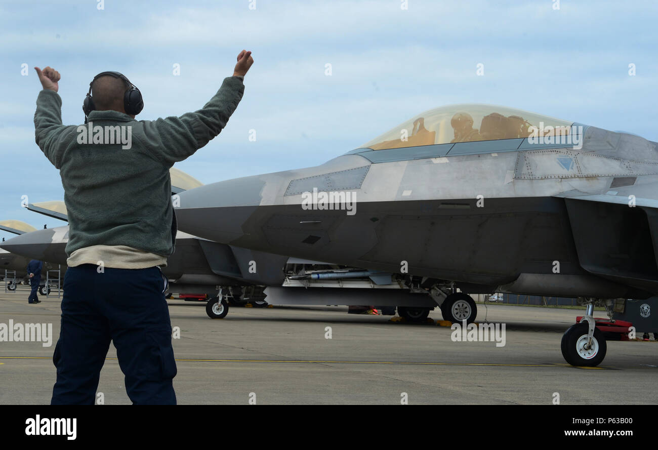 325th Maintenance Operations A maintainer assigned to the 325th Maintenance Squadron marshals an F ...