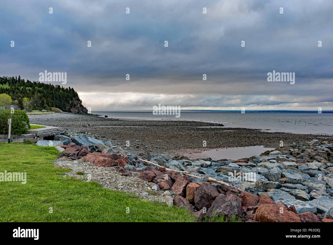 Alma beach at low tide in early morning with a view of the Bay of Fundy