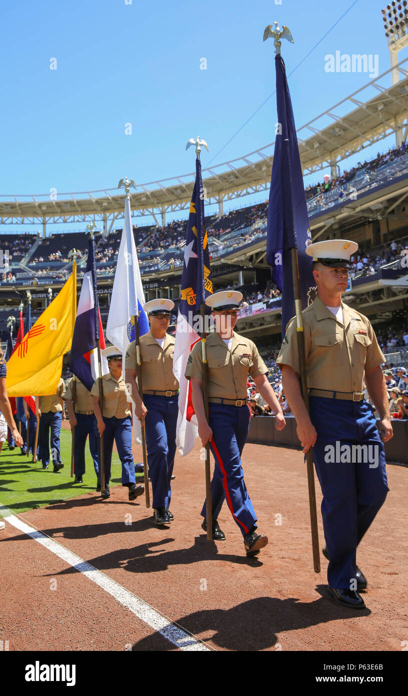 Marines from Marine Corps Recruit Depot San Diego march off the field with the state flags during the San Diego Padres Military Opening Day game at Petco Park, April 17. When the national anthem was sung, each Marine presented the flag as an honor to each state. Stock Photo