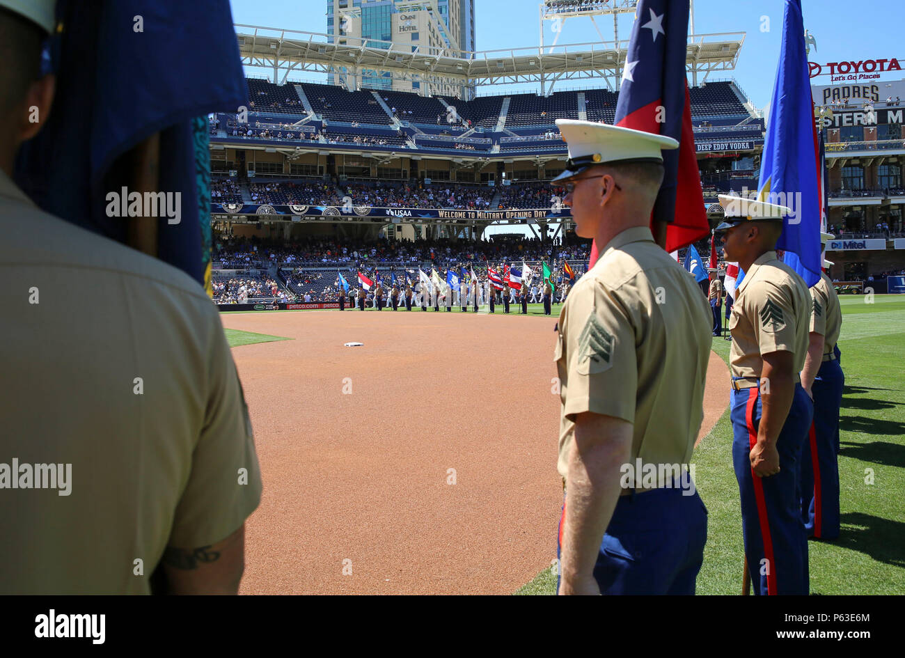 Marines from Marine Corps Recruit Depot San Diego stand at attention with the state flags before the San Diego Padres Military Opening Day game at Petco Park, April 17. When the national anthem was sung, each Marine held out and presented the flag as an honor to each state. Stock Photo
