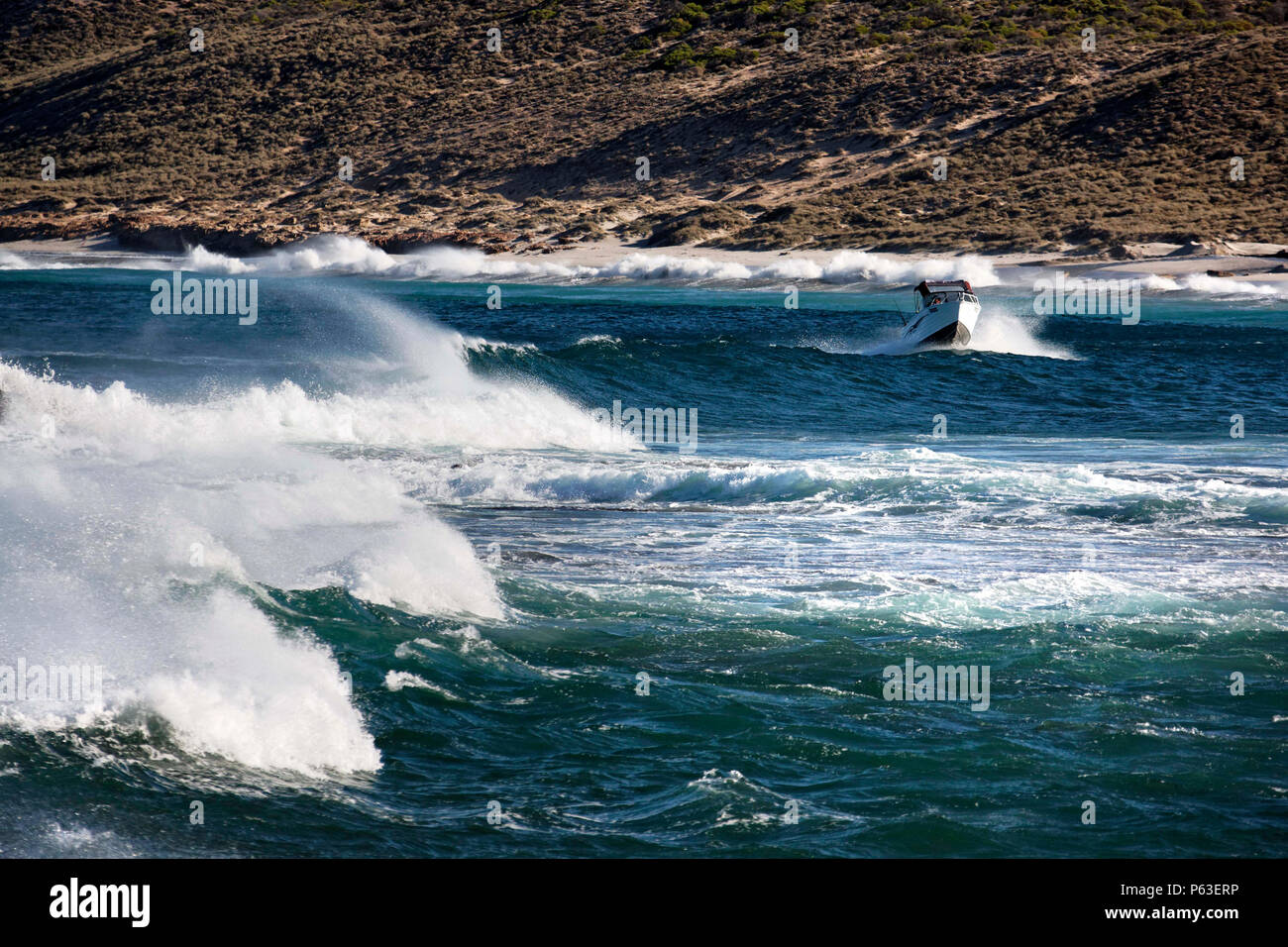 Small power boat in rough seas, Kalbarri Western Australia Stock Photo