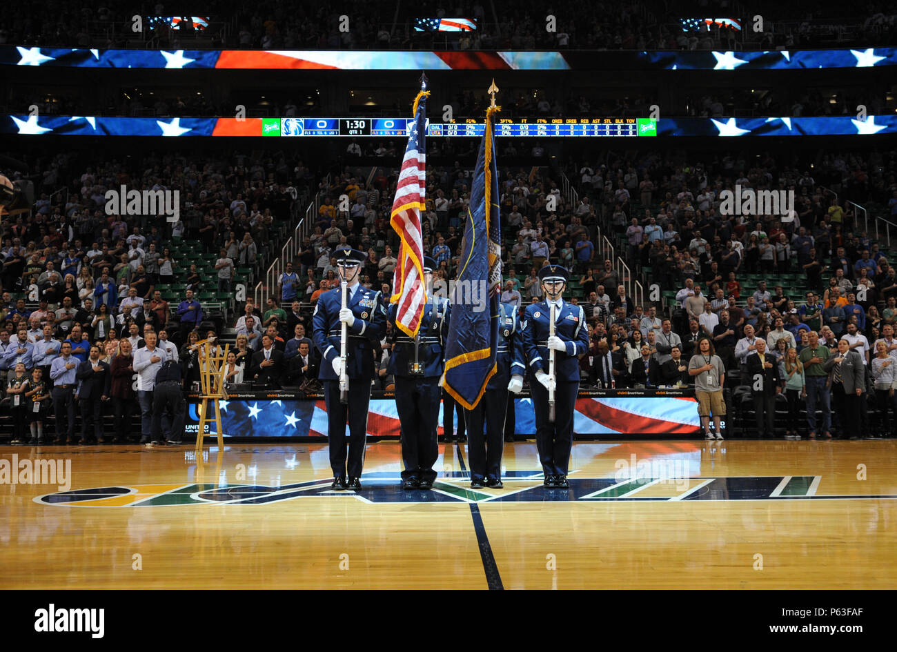 The Utah Air National Guard Honor Guard team presents the colors during the Utah Jazz game April 11, 2016, at the Vivint Smart Home Arena in Salt Lake City. The Honor Guard team has helped kick off 12 home games this season. (U.S. Air National Guard photo by Senior Airman Colton Elliott/Released) Stock Photo