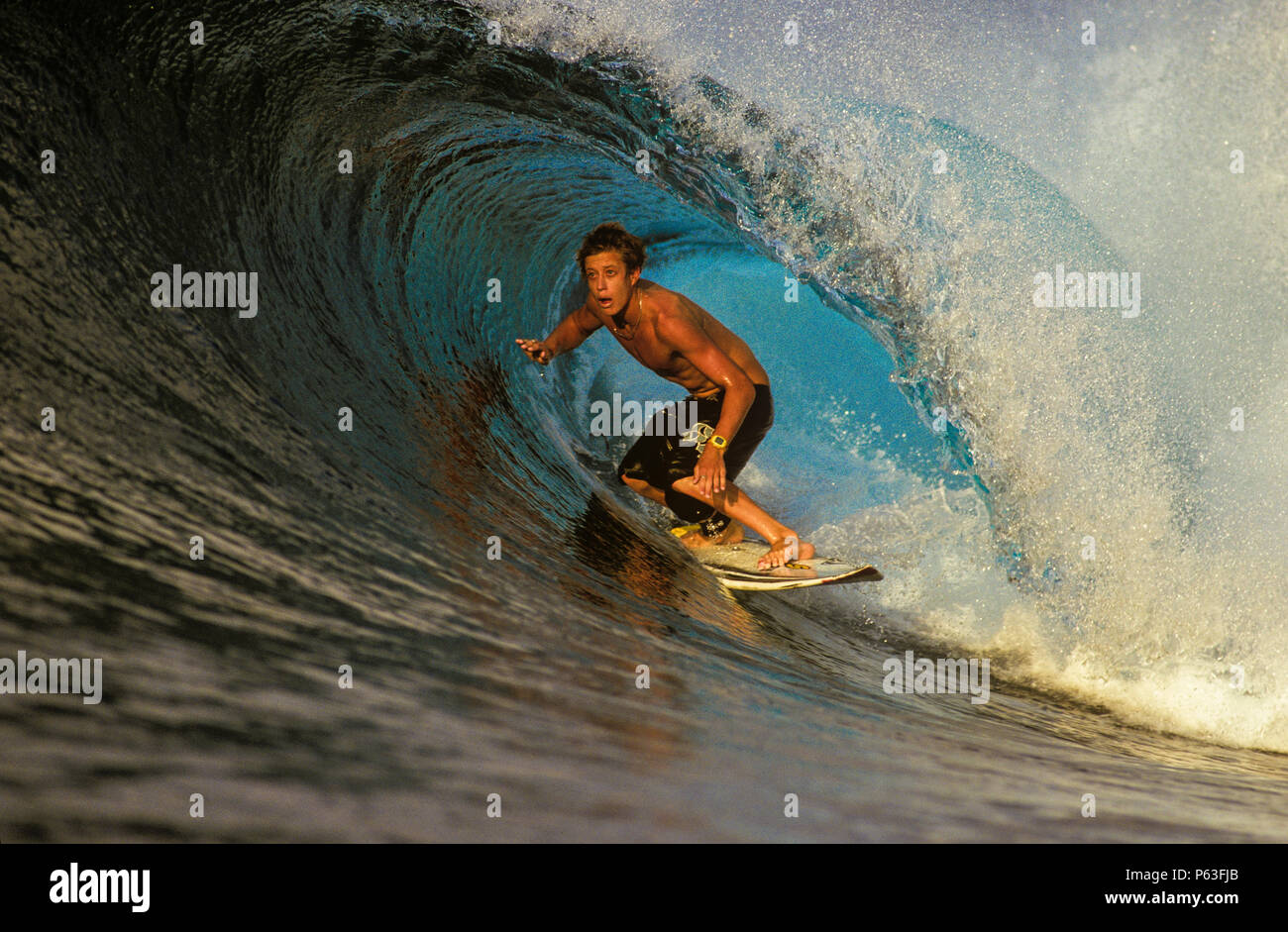 Surfing the tube at Lances Right in the Mentawai Islands, Indonesia Stock Photo