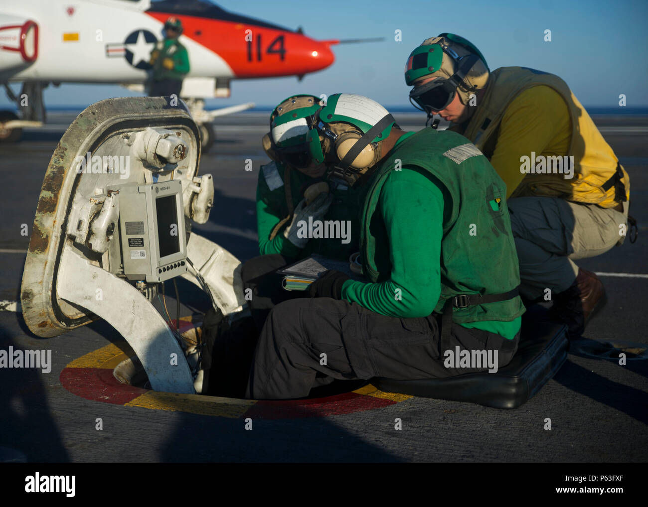 160424-VH385-N-050 ATLANTIC OCEAN (April 24, 2016) – A group of Sailors prepare for flight operations on the flight deck of the aircraft carrier USS George Washington (CVN 73). Washington, homeported in Norfolk, is underway conducting carrier qualifications in the Atlantic Ocean. (U.S. Navy photo by Mass Communication Specialist 3rd Class Wyatt L. Anthony/Released) Stock Photo