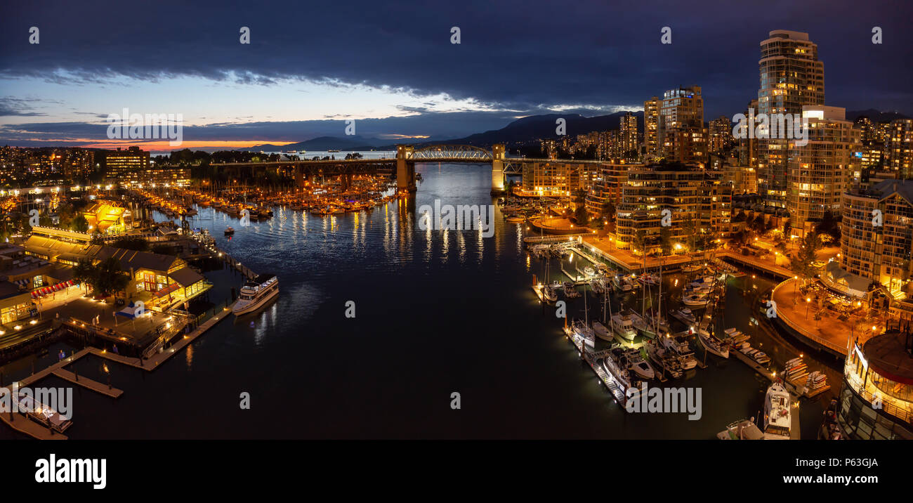 Aerial panoramic view of Downtown City during a cloudy night after ...