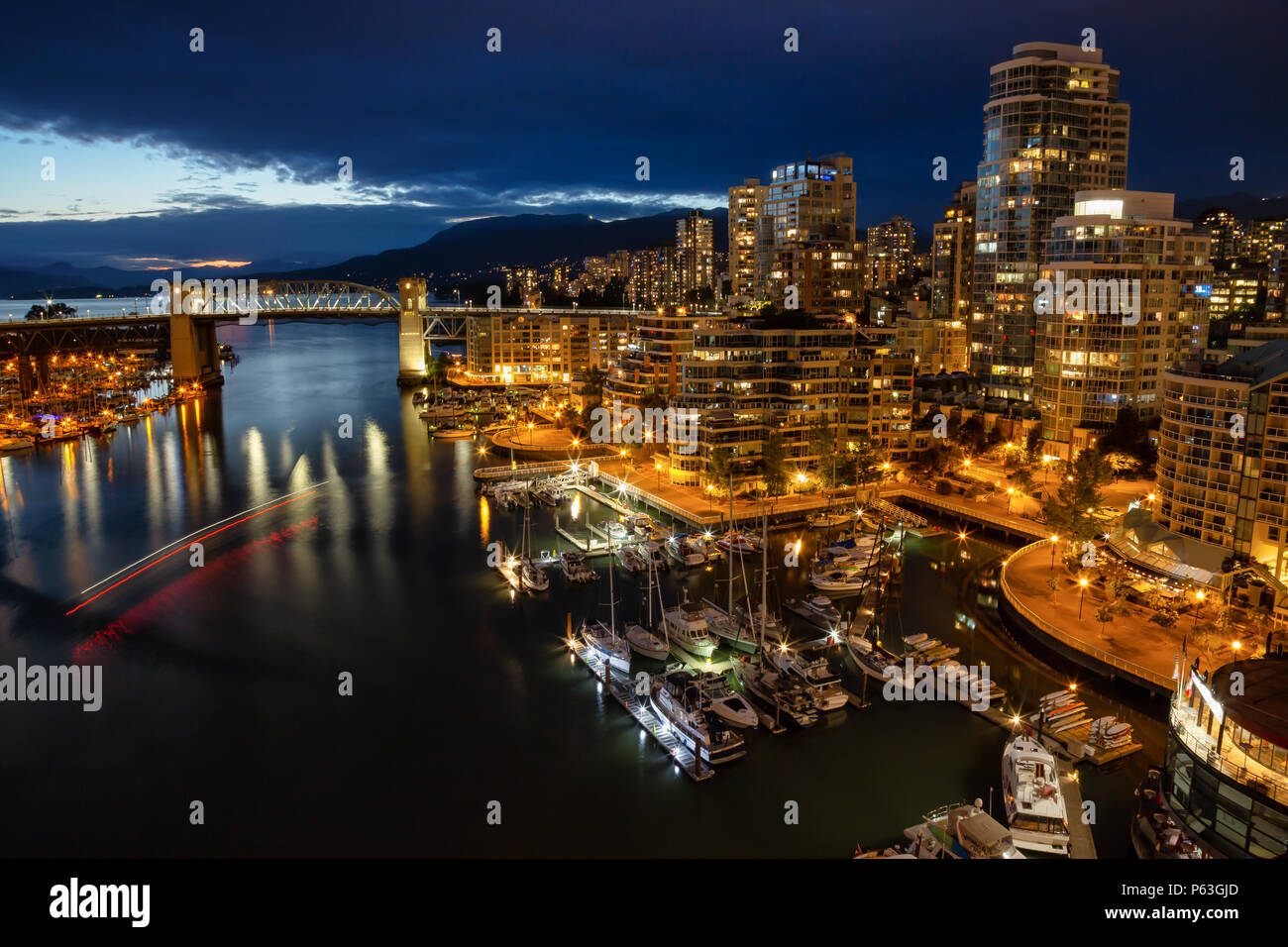 Aerial view of Downtown City during a cloudy night after sunset. Taken ...