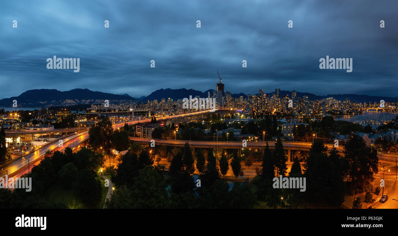 Aerial panoramic view of Downtown City during a cloudy night after ...
