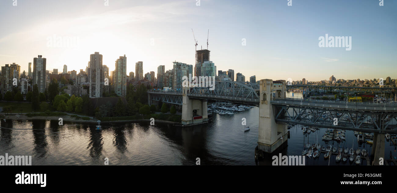 Aerial panoramic view of Burrard Bridge in False Creek During a vibrant ...