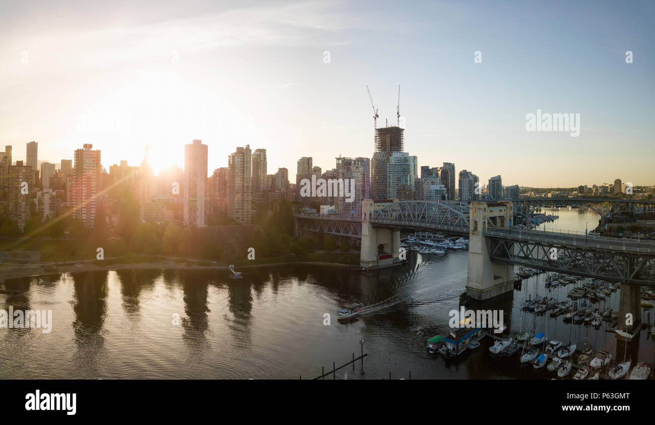 Aerial panoramic view of Burrard Bridge in False Creek During a vibrant ...