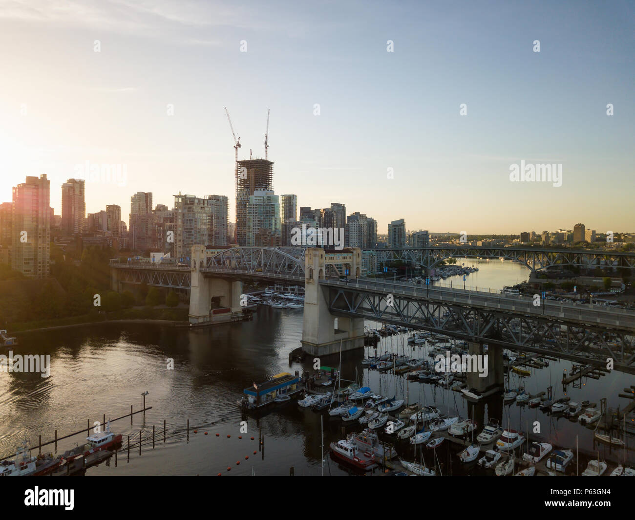 Aerial view of Burrard Bridge in False Creek During a vibrant sunrise ...