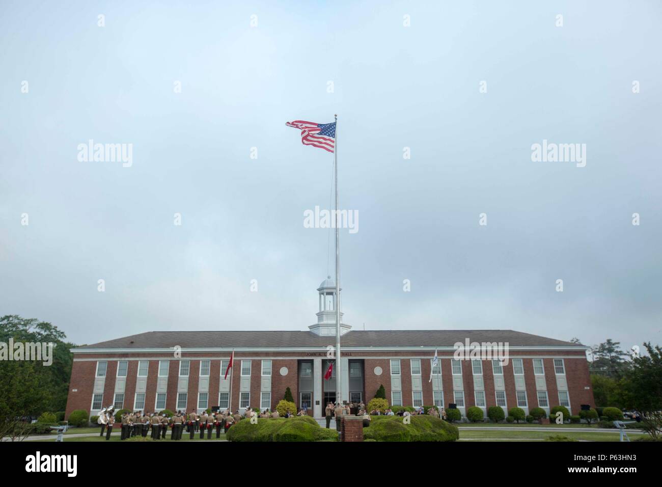 U.S. Marines with the Camp Lejeune Provost Marshal's Office, conduct morning colors during