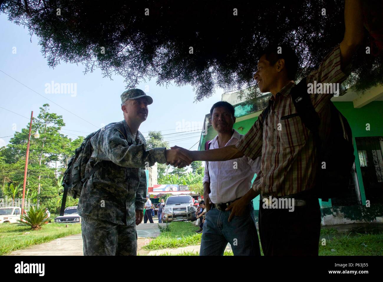 Master Sgt. Adolfo Gonzales from 71st Information Operations greets the local Cocodes to the Medical Readiness Exercise meeting as part of the Beyond The Horizon Operation at San Pablo, Guatemala, April 29, 2016. Task Force Red Wolf and Army South conducts Humanitarian Civil Assistance Training to include tactical level construction projects and Medical Readiness Training Exercises providing medical access and building schools in Guatemala with the Guatemalan Government and non-government agencies from 05MAR16 to 18JUN16 in order to improve the mission readiness of US forces and to provide a l Stock Photo