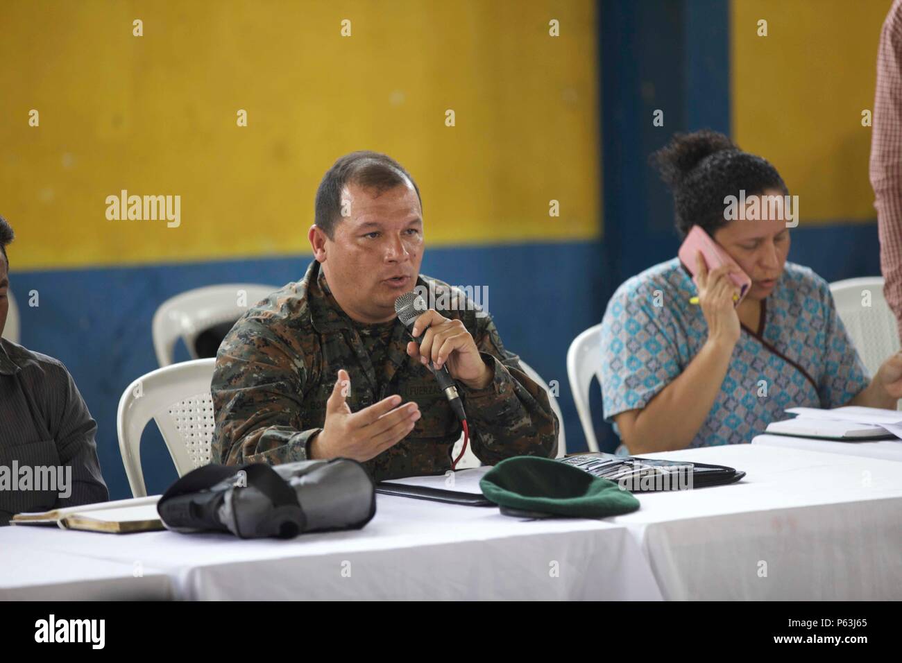 Guatemalan Armed Forces Lt. Col. Gomez speaks to the local Cocodes about what will be done at Medical Readiness Exercise as part of the Beyond the Horizon Operation at San Pablo, Guatemala, April 29, 2016. Task Force Red Wolf and Army South conducts Humanitarian Civil Assistance Training to include tactical level construction projects and Medical Readiness Training Exercises providing medical access and building schools in Guatemala with the Guatemalan Government and non-government agencies from 05MAR16 to 18JUN16 in order to improve the mission readiness of US forces and to provide a lasting  Stock Photo