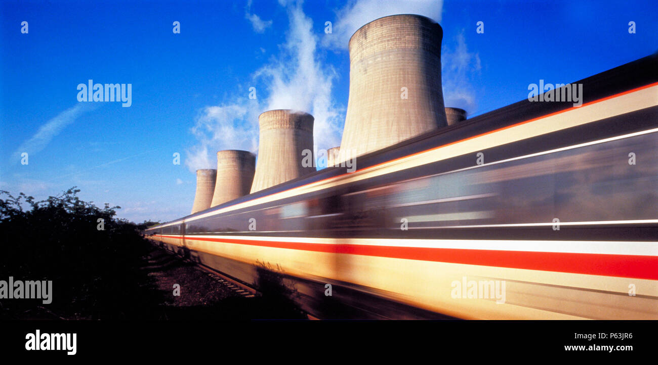 Train in motion with Ratcliffe-0n-Soar coal-fired power station, Nottingham, England, United Kingdom Stock Photo