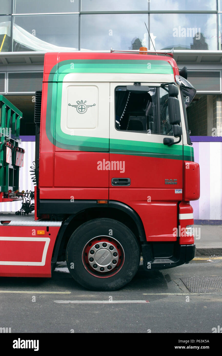 Side view of red scania lorry cab used for delivering parts to site