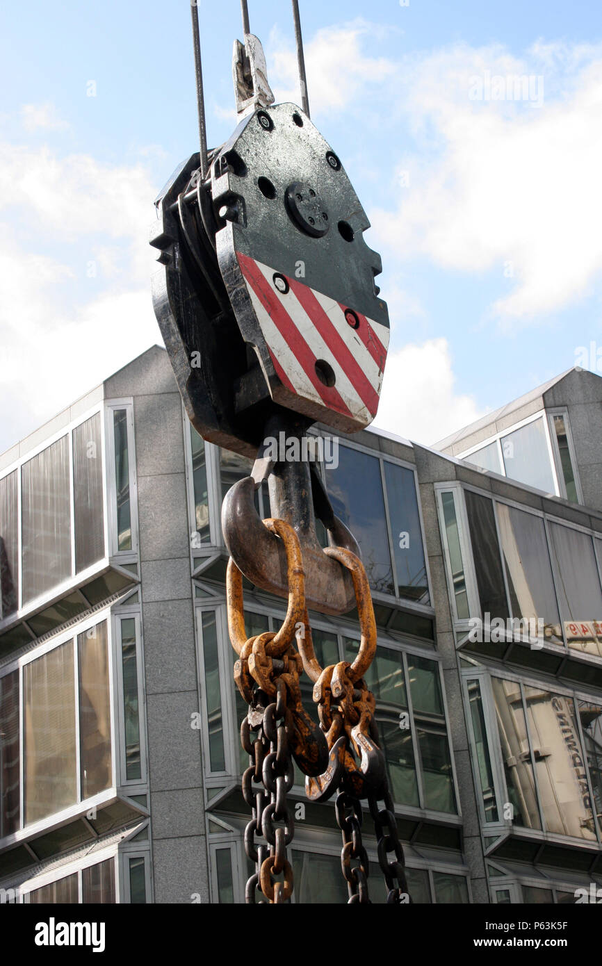 Lifting block of crane showing two chains hooked on Stock Photo Alamy