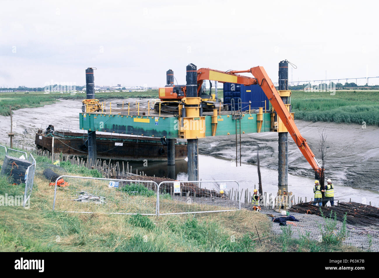 Lifting in faggots using the long reach Hitachi excavator on the jack