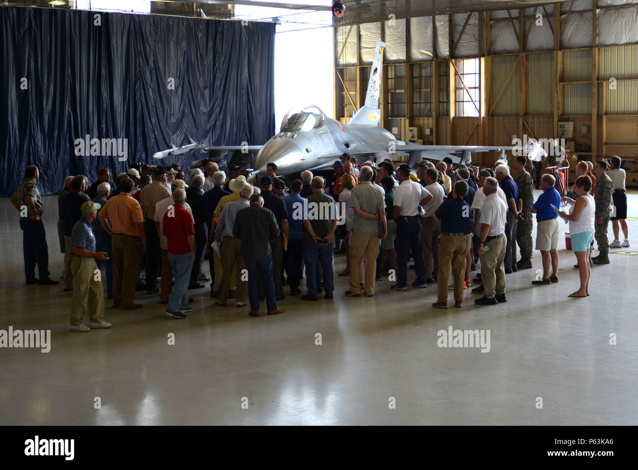 Visitors gather around an F-16CM Fighting Falcon as U.S. Air Force Maj ...