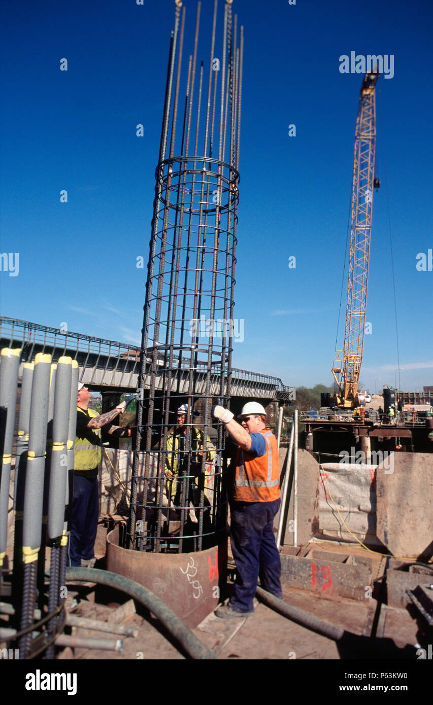 Installing a reinforcement cage for a bored pile on a bridge on