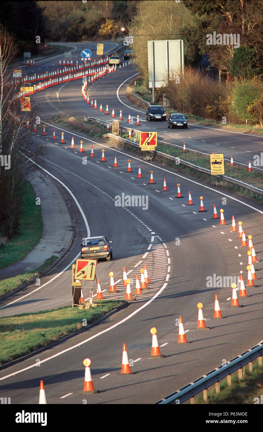 Coned off lanes for the tunnelling works on the Devils punchbowl Hindhead on the A3 road to Portsmouth, Hampshire, UK Stock Photo