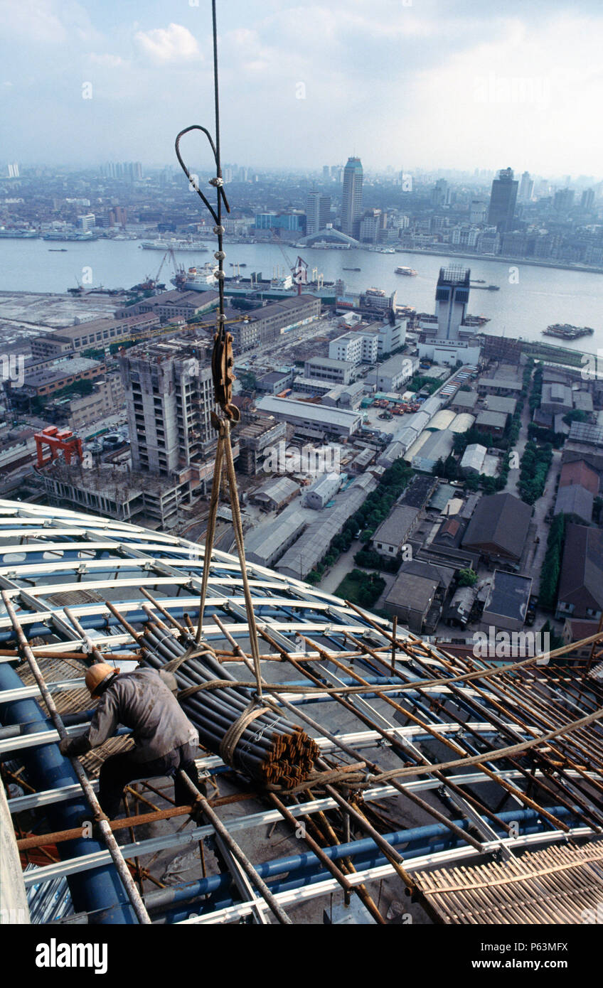Construction of the famous landmark tv tower in Pudong development zone of Shanghai China - the tower has long since become the symbol of the city wit Stock Photo