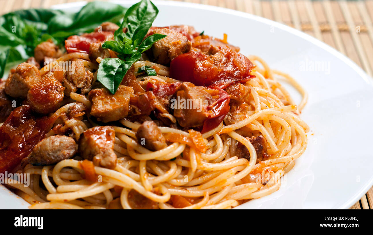 Spaghetti in tomato sauce with chicken Stock Photo Alamy