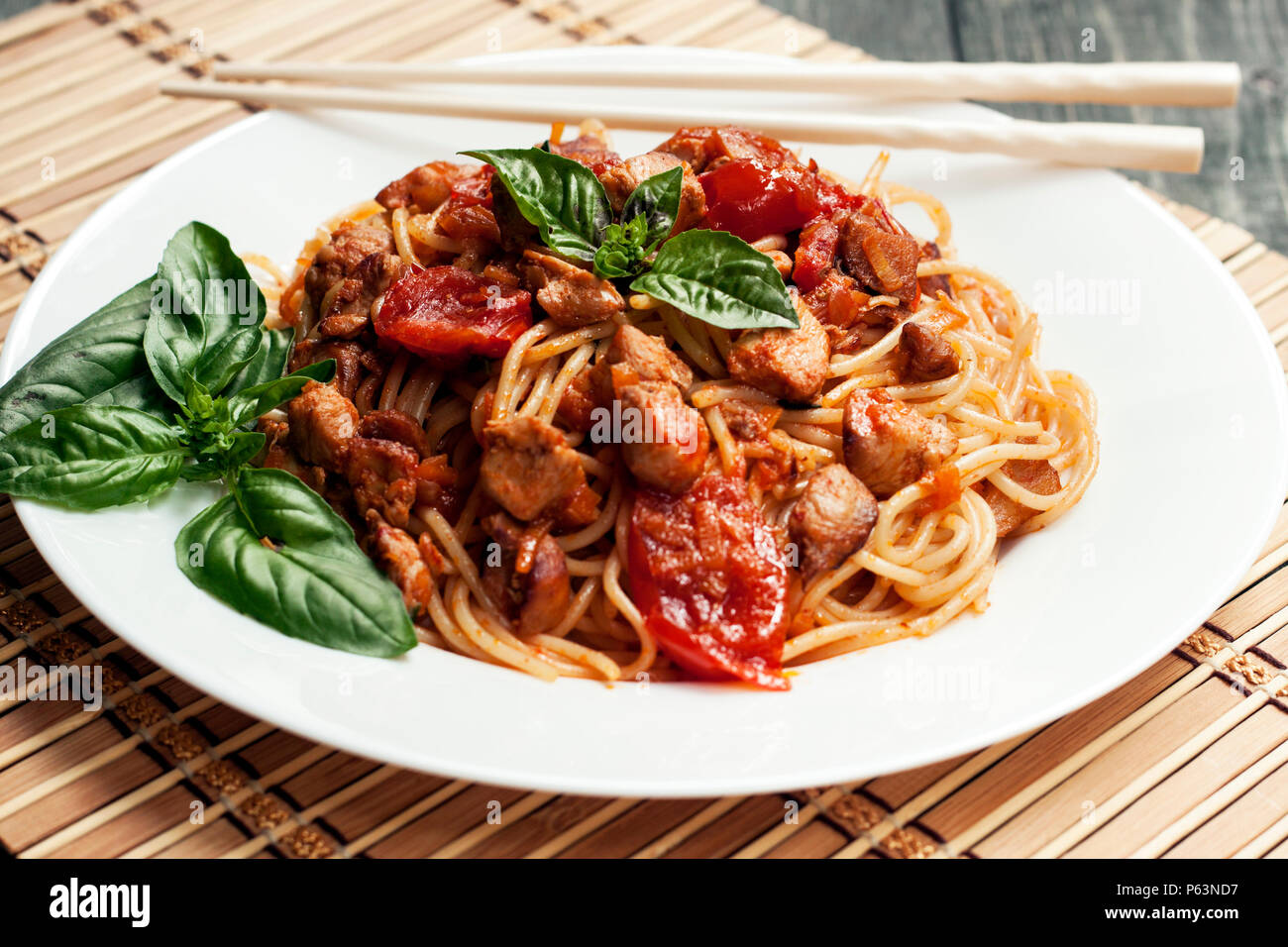 Spaghetti in tomato sauce with chicken Stock Photo Alamy