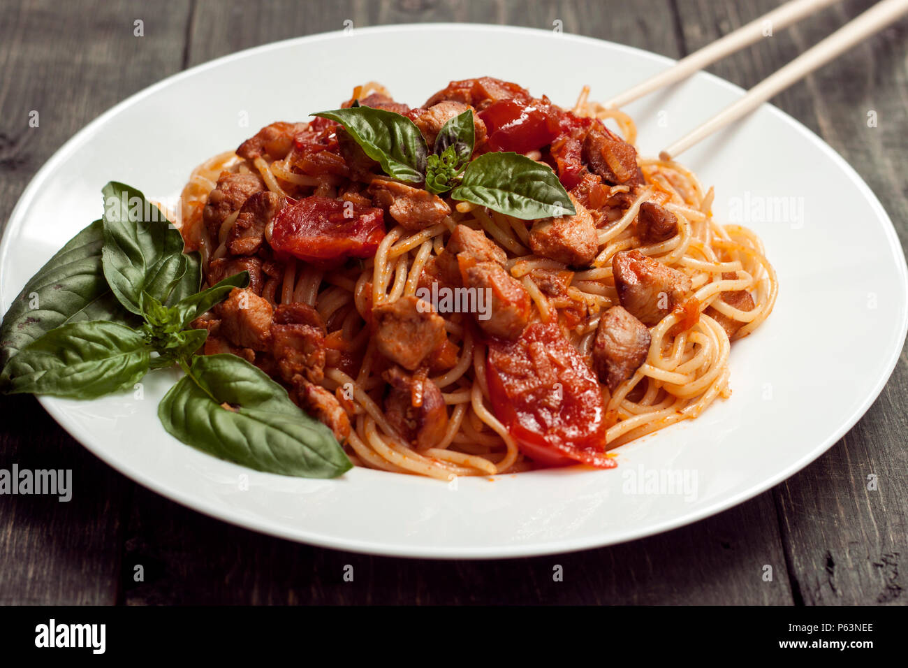 Spaghetti in tomato sauce with chicken Stock Photo Alamy