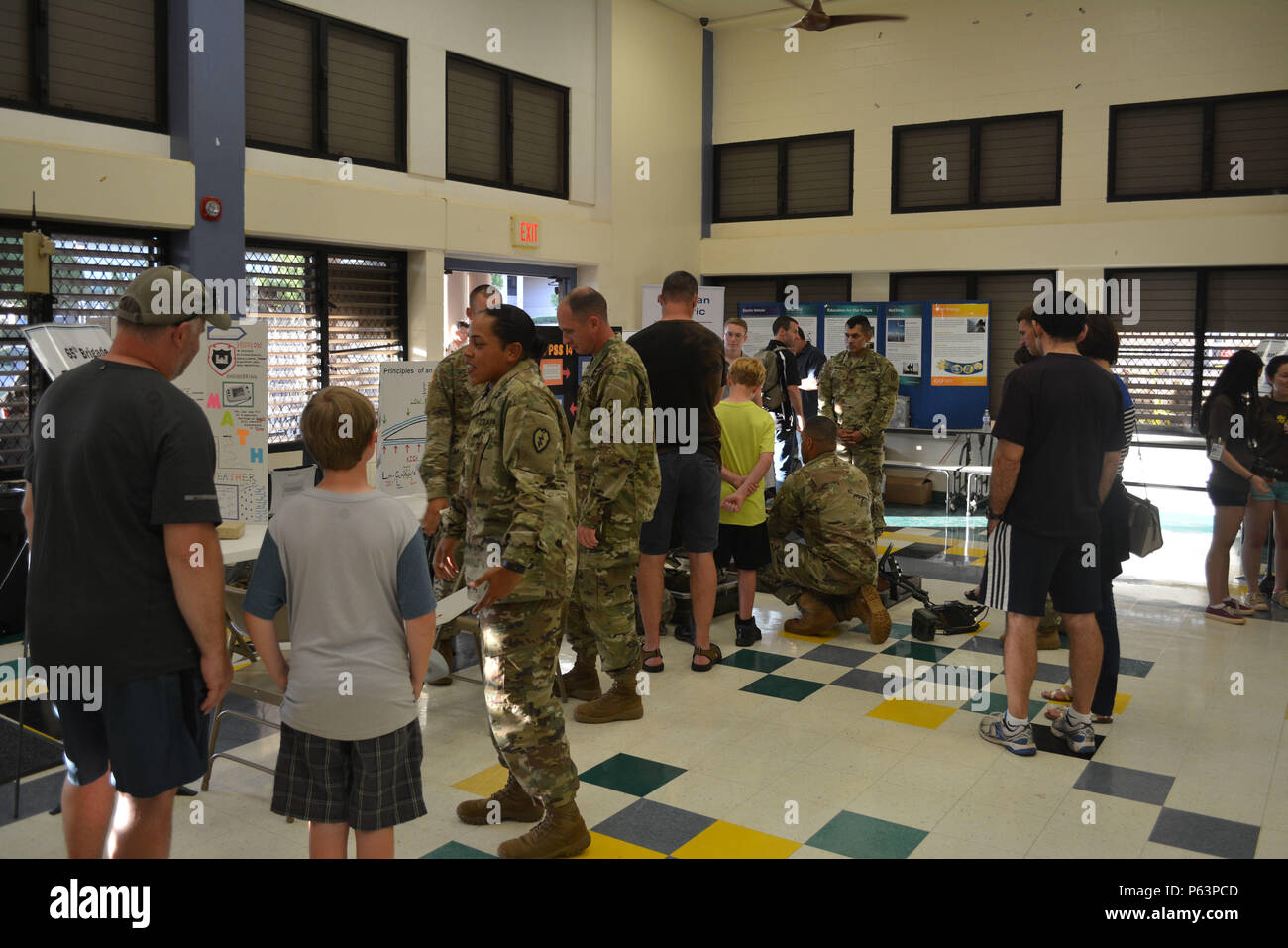 #USArmy Soldiers from 65th Brigade Engineer Battalion, 2nd Brigade Combat Team, 25th Infantry Division, visit Mililani Mauka Elementary School to take part in their science, technology, engineering and math education (STEM) night Apr. 9, 2016. Events such as these provide Soldiers a chance to interact with families, students and the community by improving relations. (U.S. Army photo by Staff Sgt. Carlos Davis, 2nd Stryker Brigade Combat Team, 25th Infantry Division Public Affairs). Stock Photo