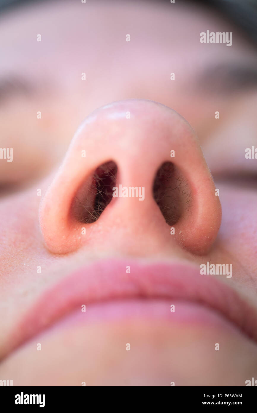 Looking into a female's nose. Stock Photo