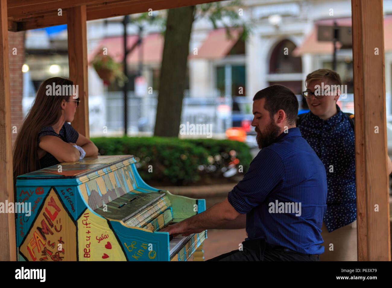 Lancaster, PA, USA - June 25, 2018: In downtown Lancaster City, colorful pianos are played by people passing by, filling the street with impromptu sou Stock Photo
