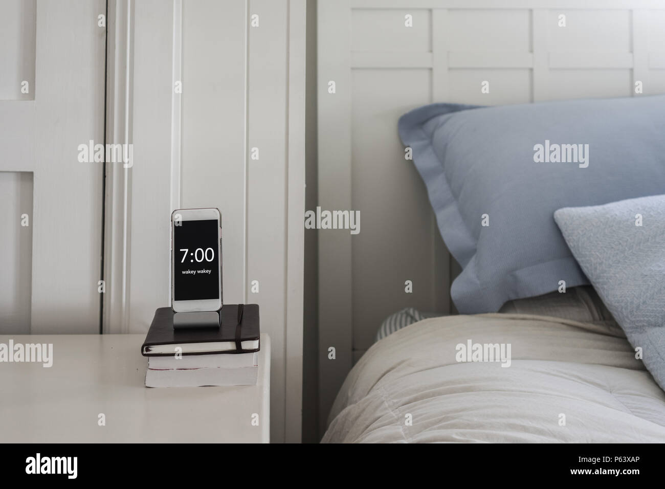 phone beside bed as alarm clock Stock Photo Alamy