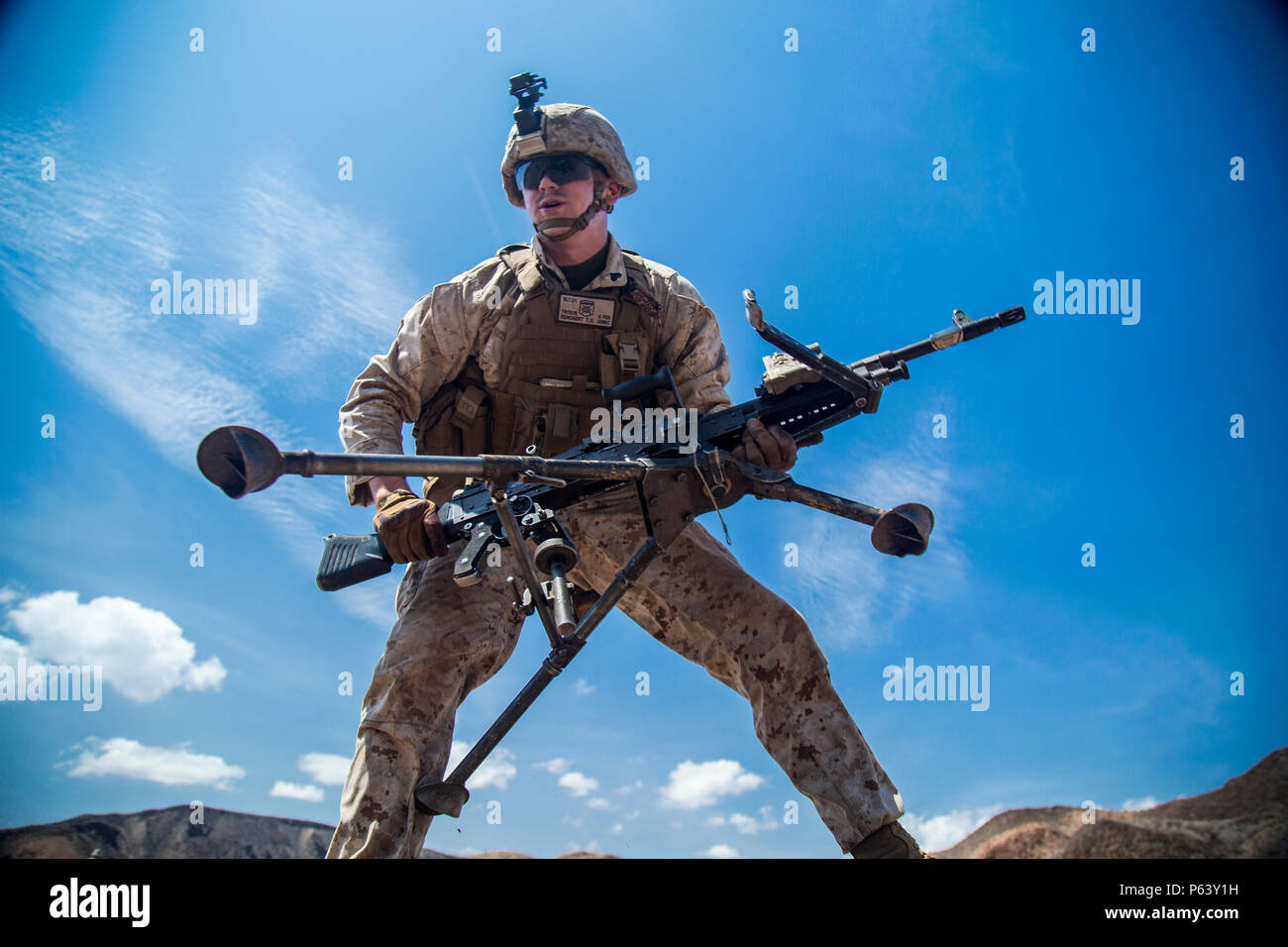 A Marine from the 13th MEU moves with an M-240 Bravo to a new firing ...