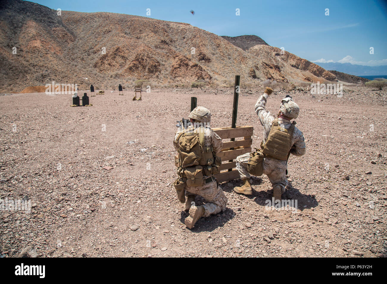 A U.S. Marine from the 13th MEU throws a simulated fragmentation ...
