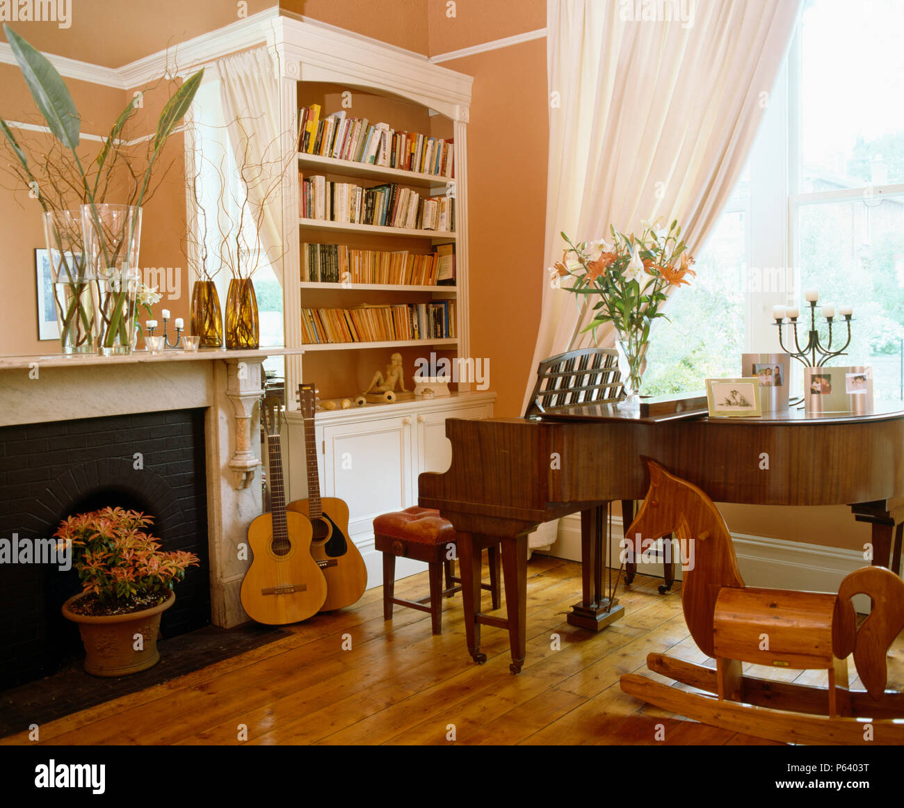 Grand Piano And Guitars In Living Room With Highly Polished Wooden
