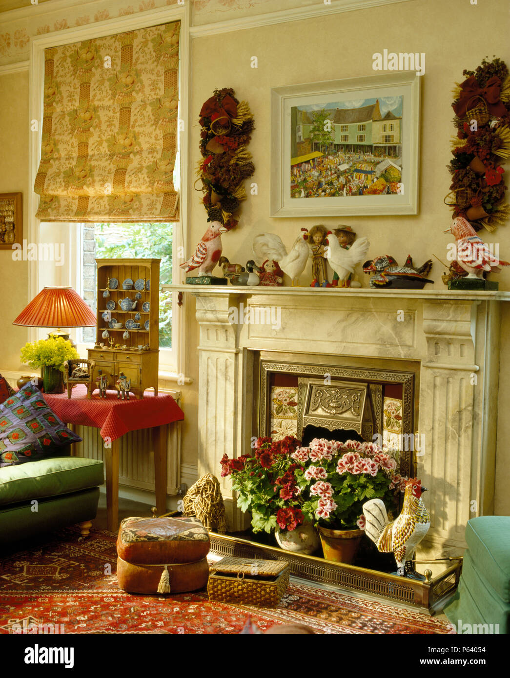 Dried Flower Garlands Above Fireplace With Pots Of Pelargoniums In