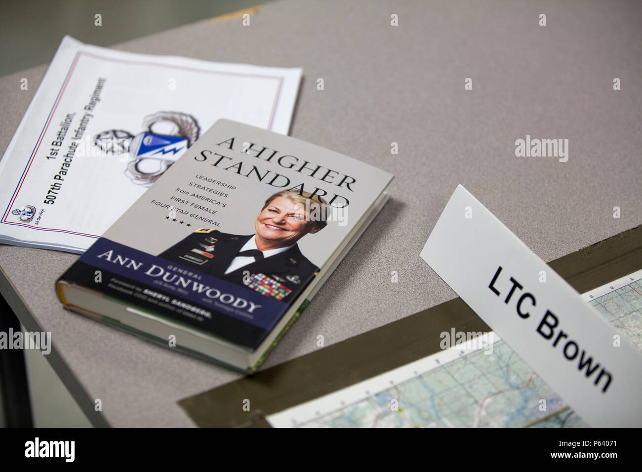 A book written by Retired U.S. Army Gen. Ann E. Dunwoody, sits on display during a brief before the wreath-laying ceremony begins in support of The 39th Annual U.S. Army Airborne Awards Festival, Fort Benning, Ga., April 15, 2016. The 39th Annual Airborne Awards Festival recognizes active duty and retired airborne soldiers of all services. It serves to extend the brotherhood of the airborne ethos. (U.S. Army photo by Spc. Tracy McKithern/Released) Stock Photo
