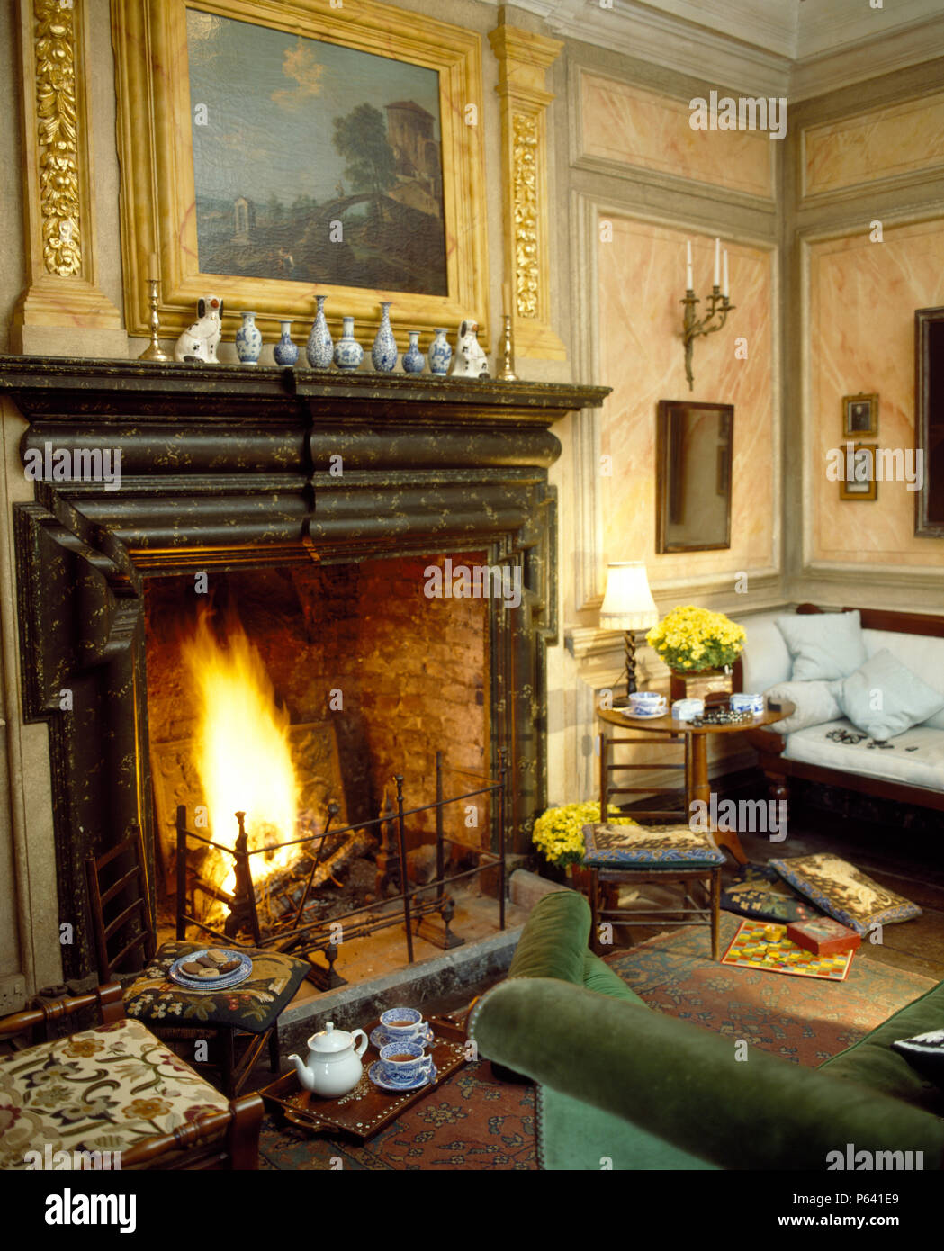 Fireplace With Lighted Fire And Marble Mantelpiece In Country