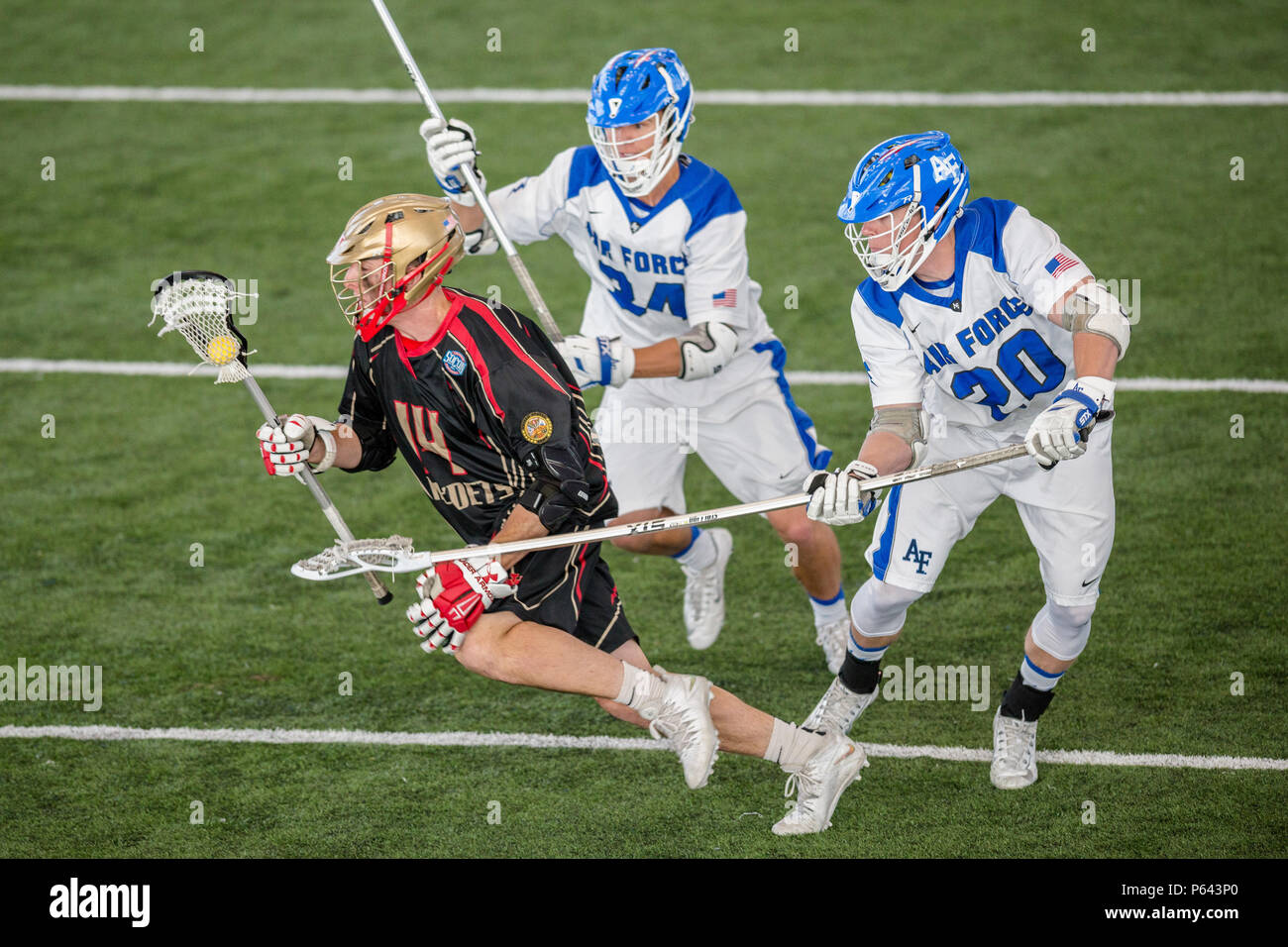 Air Force lacrosse players Sheamus Larkin and Alex Warden pressure a