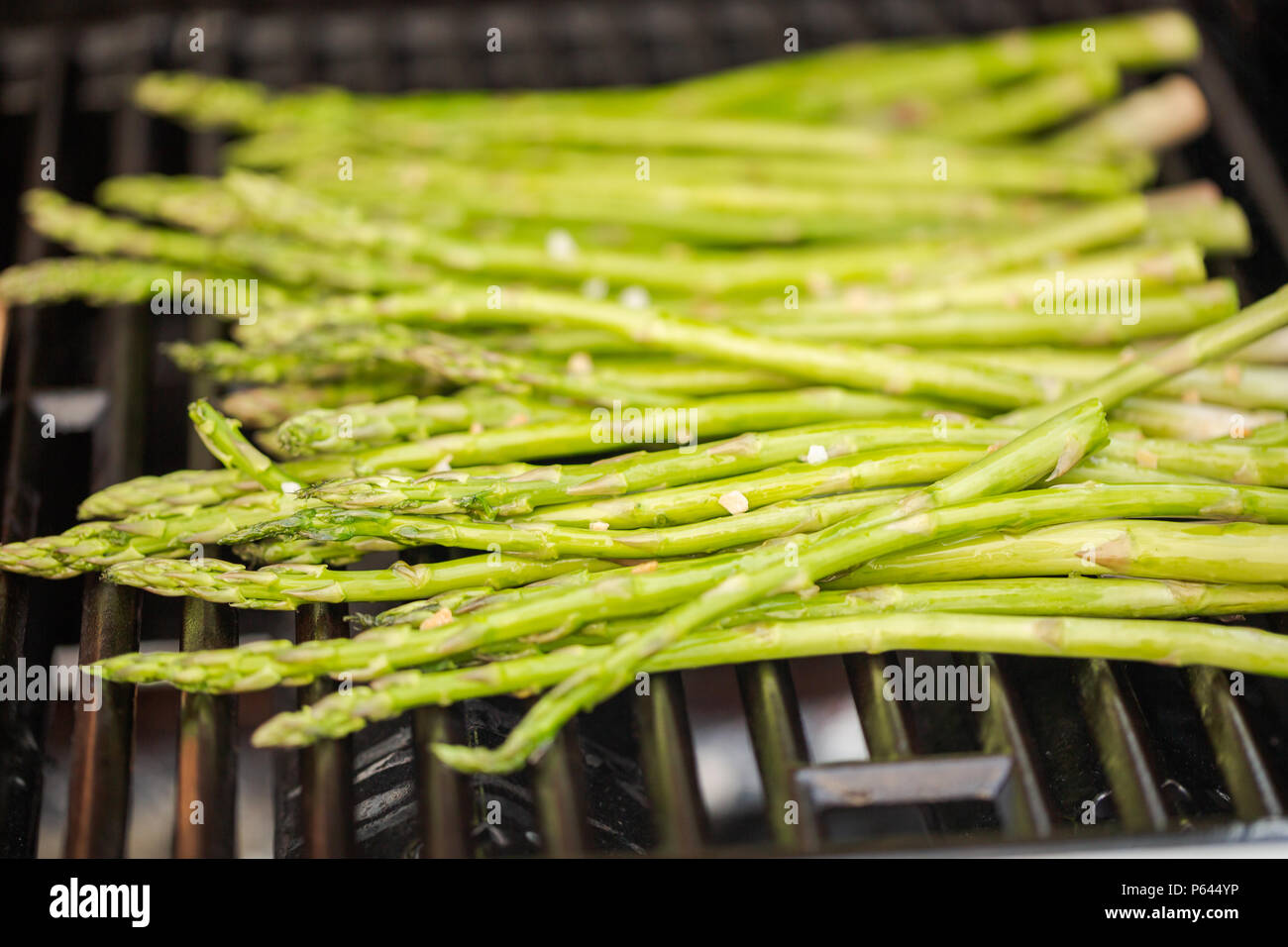 Grilling fresh asparagus on outdoor gas grill Stock Photo Alamy