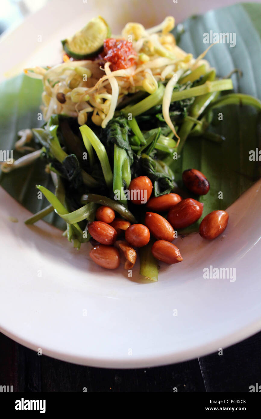 Plecing kangkung, a traditional salad dish from Lombok or Bali, Indonesia. Stock Photo