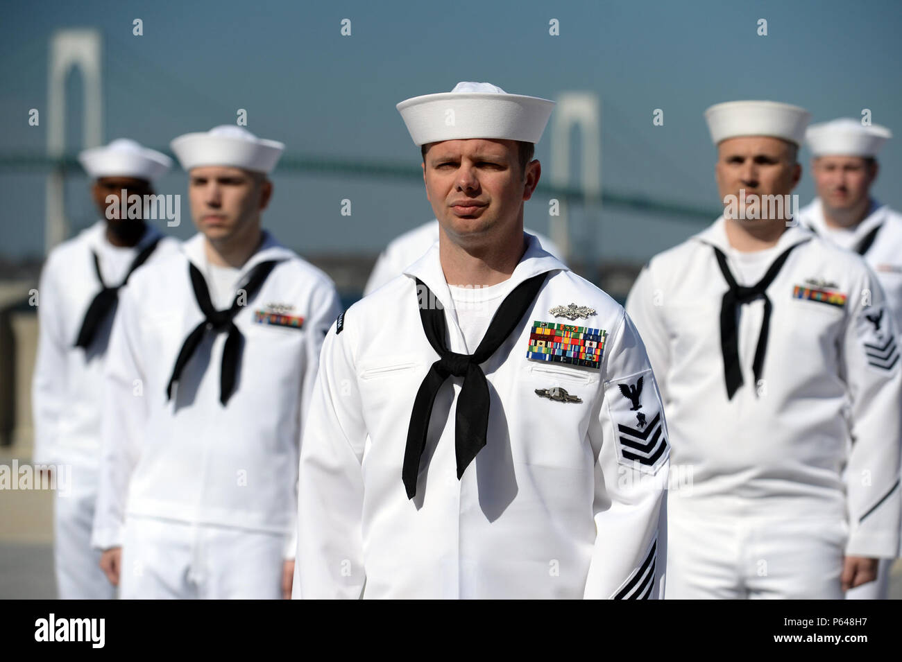 160419-N-PX557-042 NEWPORT, R.I. (April 19, 2016) Builder 1st Class Matthew  Johnson, assigned to U.S. Naval War College (NWC), stands in formation  during a service dress white uniform inspection of enlisted personnel at