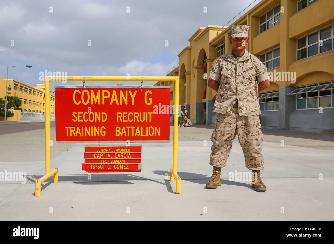 Private Sylviano R. Gonzalez, Golf Company, 2nd Recruit Training Battalion, stands next to his squad bay at Marine Corps Recruit Depot San Diego, April 25. Following recruit training, Gonzalez will report to the School of Infantry at Marine Corps Base Camp Pendleton, Calif., to become an infantryman. Annually, more than 17,000 males recruited from the Western Recruiting Region are trained at MCRD San Diego. Golf Company is scheduled to graduate April 29. Stock Photo