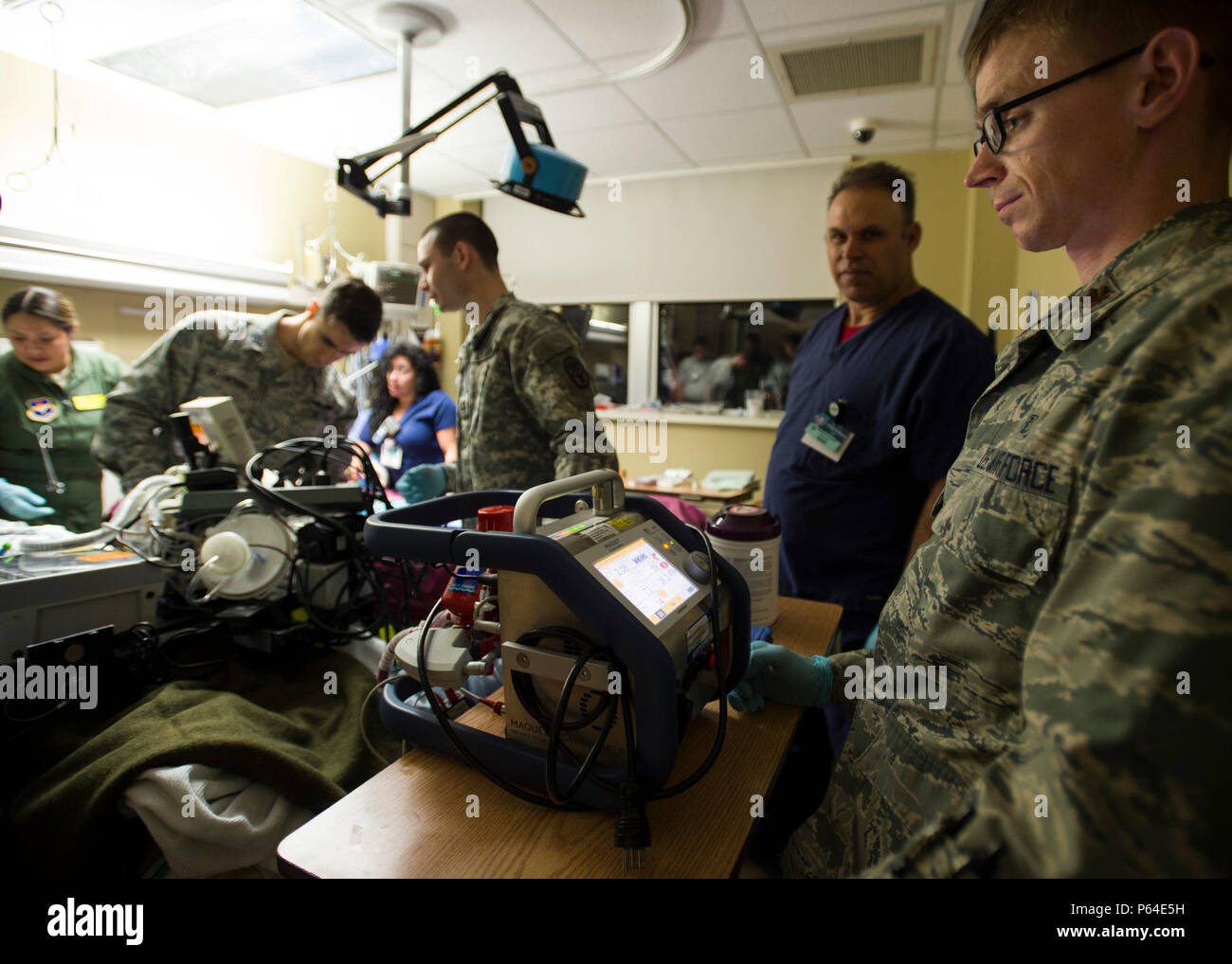 Maj. James Lantry (right), Extracorporeal Membrane Oxygenation transport team vice director, watches for stabilization on the ECMO system prior to transporting the patient to San Antonio Military Medical Center, Joint Base San Antonio-Fort Sam Houston, Texas, April 20. Prior to a patient being transferred to a new location, a patient’s vital must be stable for four hours. Stock Photo