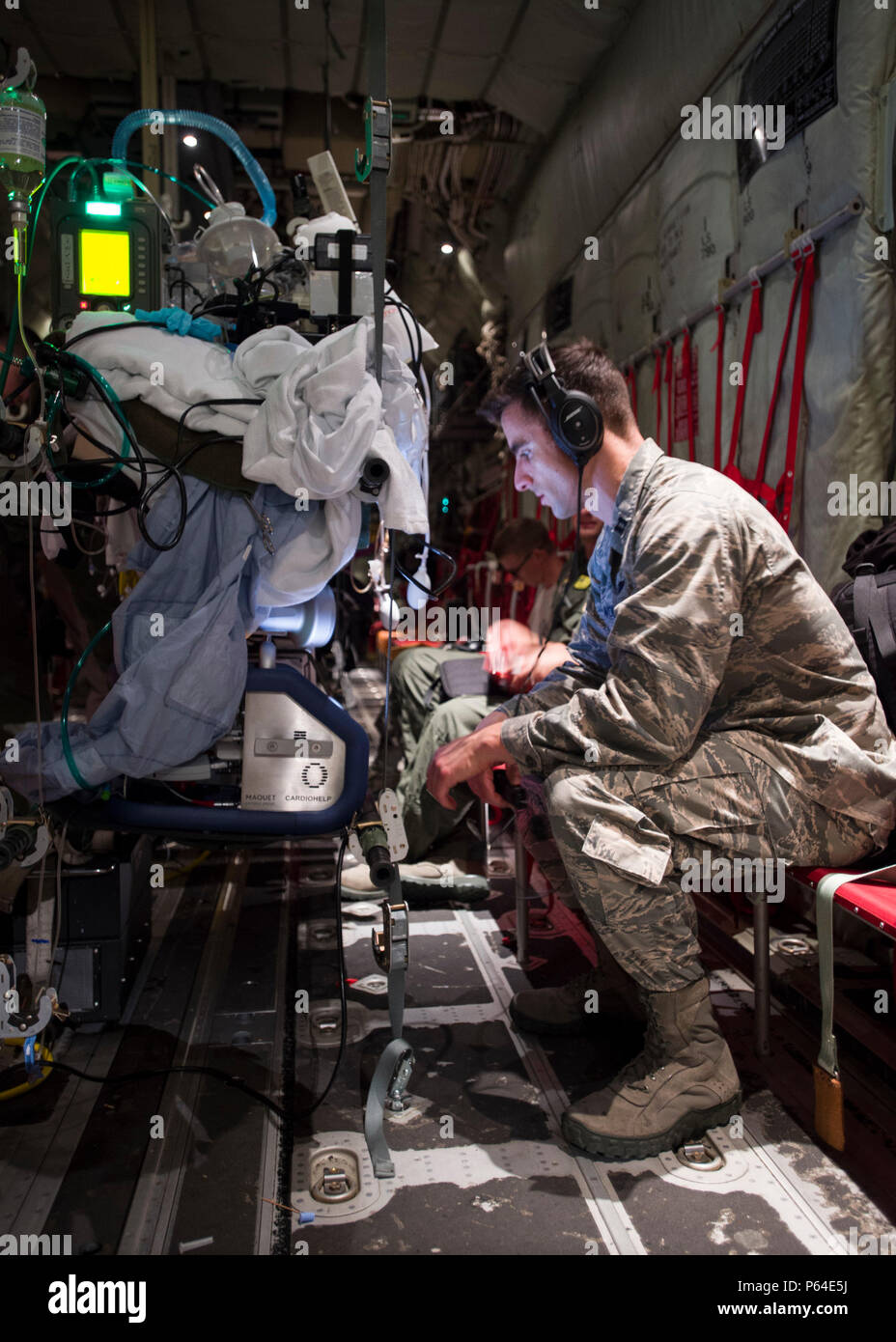 Capt. Jeffrey Dellavolpe, 959th Medical Operations Squadron critical care physician, regulates the Extracorporeal Membrane Oxygenation system during a flight to San Antonio Military Medical Center, Joint Base San Antonio-Fort Sam Houston, Texas, April 20. ECMO is a heart-lung bypass system that circulates blood through an external artificial lung and sends it back into the patient’s bloodstream. Stock Photo