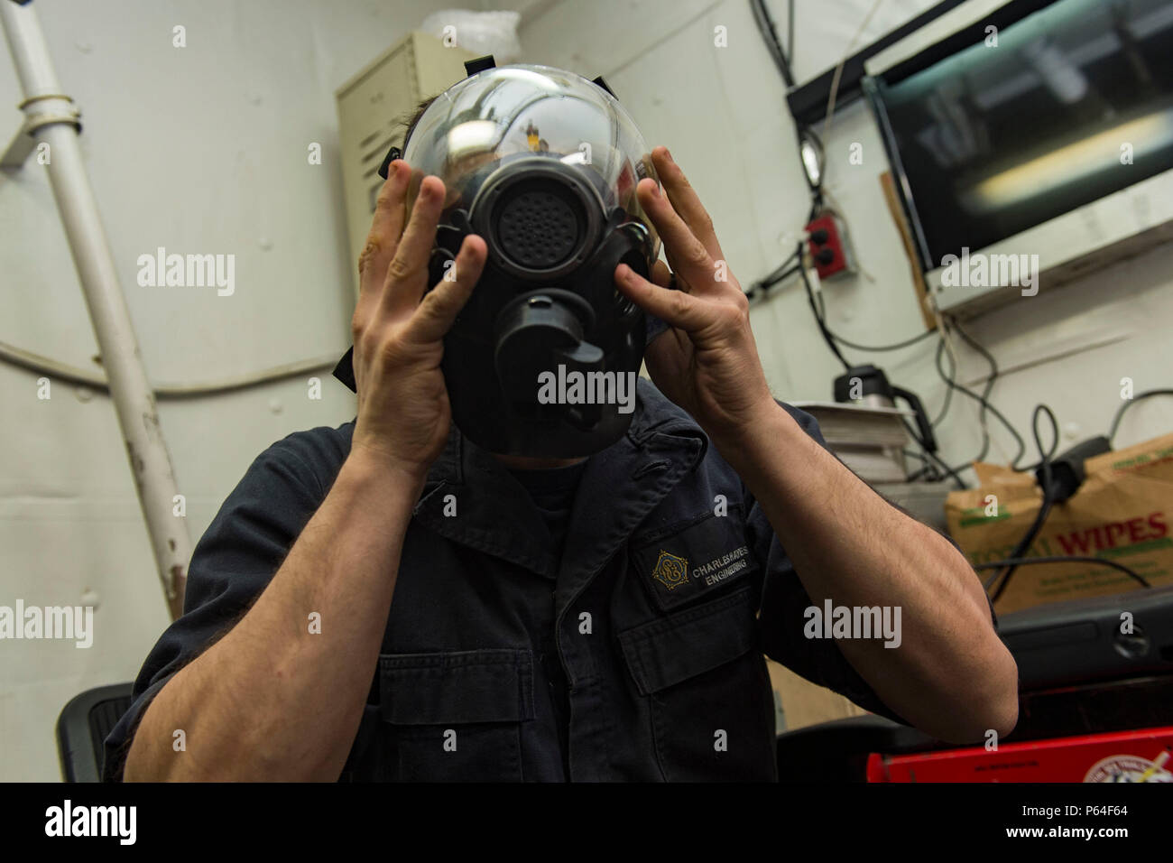 160409-N-EO381-077  ATLANTIC OCEAN (April 9, 2016) - Damage Controlman Fireman Charles Hayes tests an MCU-2P gas mask aboard the aircraft carrier USS Dwight D. Eisenhower (CVN 69), the flagship of the Eisenhower Carrier Strike Group. Ike is underway conducting a Composite Training Unit Exercise (COMPTUEX) with the Eisenhower Carrier Strike Group in preparation for a future deployment. (U.S. Navy photo by Mass Communication Specialist Seaman Casey J. Hopkins/Released) Stock Photo