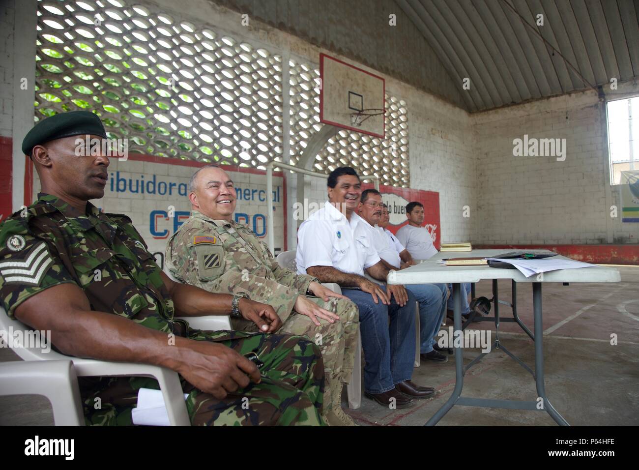 Joint Military members and Mayor Armufo Cordeno speak to the local Cocodes about the future Medical Treatment Exercise as part of The Beyond The Horizon Operation at La Blanca, Guatemala, May 04, 2016. Task Force Red Wolf and Army South conducts Humanitarian Civil Assistance Training to include tactical level construction projects and Medical Readiness Training Exercises providing medical access and building schools in Guatemala with the Guatemalan Government and non-government agencies from 05MAR16 to 18JUN16 in order to improve the mission readiness of US forces and to provide a lasting bene Stock Photo